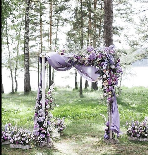 Perfect arch! Side arrangement goes to the ground instead just an incomplete bunched flowers. The top side arrangement cascades and reaches instead of a glob of flowers in the middle. This has rhythm and style! Wedding Centerpieces Lavender Color, Unique Wedding Arches Outdoors, Wedding Arch Flowers Purple, Purple Chuppah, Arbor Wisteria, Wedding Arch Purple, Levander Wedding, Purple Wedding Arch, Dholki Ideas