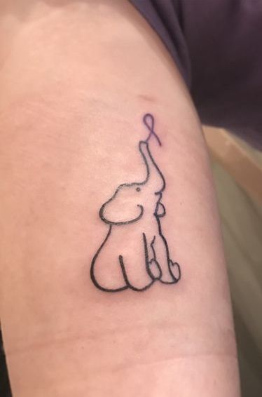 Elephant holding purple ribbon sleeve tattoo which is the sign of Alzheimer. Alzheimer’s Tattoo, Purple Ribbon Tattoos, Alzheimers Tattoo, Crohns Tattoo, Pink Ribbon Tattoos, Wild Goat, Tattoo Elephant, Survivor Tattoo, Alzheimer's Awareness