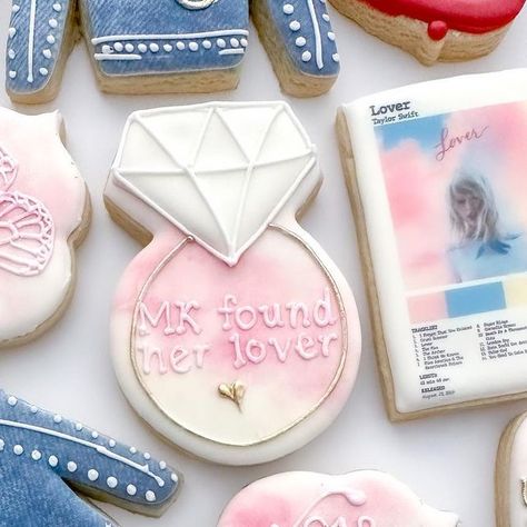 Briana Haluska | The Cookie Boss on Instagram: "She found her her her… LOVER💖✨ #cookieboss518 #bachtobasic #stagandhen #lover #loverera #shefoundherlover #bacheloretteparty #bachelorettepartyweekend #bachelorettepartycookies #jeanjacket #ringcookies #tswift #tstheerastour #swiftlover #swiftnation #misstomrs #futuremrs #taylorswift #sugarcookiemarketing #smallbusinessowner #bridetobe #bridalguide #bgbride #cookieart #edibleprint #teambride #weddingcookies #bridalshowercookies" Taylor Swift Bridal Shower Cookies, She Found Her Lover, Bachelorette Party Cookies, Engagement Cookies, Mary's Bridal, Bachelorette Party Weekend, Bridal Shower Cookies, Bridal Guide, Edible Printing