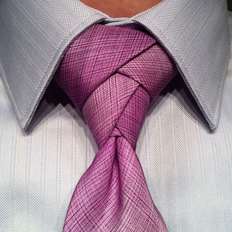 Learning How To Tie The Eldredge Knot is a step towards the metaphorical stylistic edge. A way of leaping out of your comfort zone, and trying something truly unique and different. In this blog post, we will cover How To Tie The Eldredge Knot, in addition to discussing the history of the knot and when it is appropriate to wear one! #tieknots Eldridge Knot, Different Tie Knots, Eldredge Knot, Tie A Necktie, Neck Tie Knots, Tie Men, Gentleman Style, Tie Knots, Suit And Tie