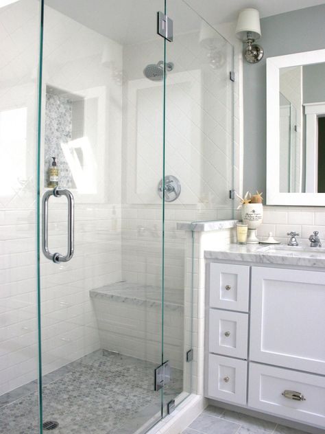 A glass-enclosed shower with white tile walls and a gray mosaic tile floor is adjacent to a marble vanity with white under-counter cabinets. Murphy Beds, Bathroom Remodel Shower, Bathroom Redo, Trendy Bathroom, Shower Remodel, Bathroom Renos, Shower Stall, Bathroom Remodel Master, Bath Tub