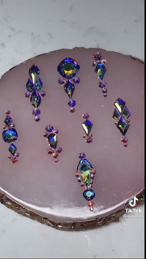 There's a new beauty trend taking over Instagram and it's absolutely stunning. Say hello to "quartz nails". Nail Jewels Rhinestones, Rhyme Stones Nails, Short Nail Gem Placement, Diamond Layout For Nails, Gemstone Nail Art Rhinestones, Gem Layout Nails, Kiara Sky Jelly Nails, How To Put Diamonds On Nails, Nail Charm Placement Ideas