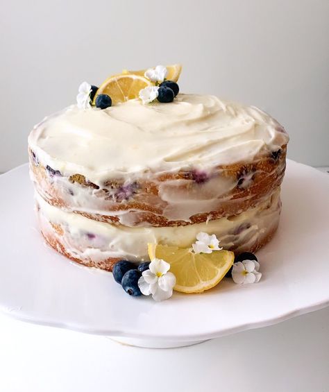 A lemon cake with blueberries and a lemon buttercream frosting #lemon #lemoncake #blueberry #lemonblueberrycake #cottagecore Lemon Blueberry Cake Aesthetic, Lake Bday Party Ideas, Lemon Cake Aesthetic, Cottagecore Cake, Blueberry Lemon Cake Recipe, Fall Birthday Cakes, Cake With Blueberries, Baptism Reception, Homemade Birthday Cake