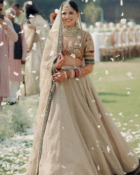 Not everyone can pull off a beige lehenga and rock the look. The bride of the week, Tanvi Singh donned a beige-colored lehenga, designed by Sabyasachi Mukherjee, and looked extremely graceful🤎🤍 Bride: @tanvisiingh28 Outfit: @bridesofsabyasachi @sabyasachiofficial Photography: @fourfoldpictures #sabyasachi #sabyasachibride #bride #bridaloutfit #brideoftheday #brideoftheweek #bridalmakeup #bridalwear #bridemakeup #bride2024 Beige Lehenga, Sabyasachi Lehenga Bridal, Sabyasachi Mukherjee, Lehenga Bridal, Sabyasachi Bride, Sabyasachi Lehenga, Blouse Work, Bride Makeup, Grand Entrance