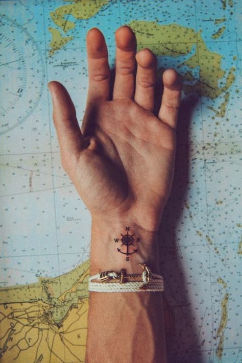 At least the guys on Pinterest are, based on the platform's revealing look at tattoo trends. Compass Tattoo Men, Compass Tattoo Design, Wrist Tattoos For Guys, Nautical Tattoo, Compass Design, Anchor Tattoo, Tato Lengan, Small Wrist Tattoos, Cool Small Tattoos