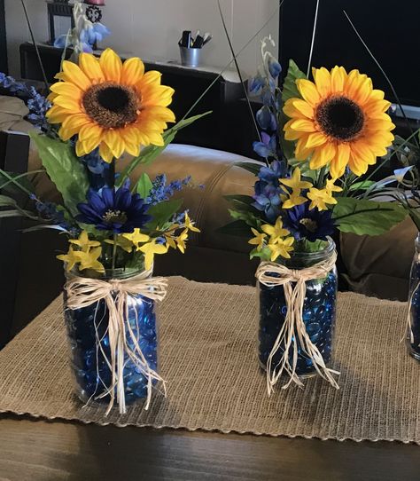 Blue and gold are great together. Bold, strong, warm and friendly. Sunflower Table Centerpieces, Ffa Banquet, Sunflower Wedding Centerpieces, Sunflower Weddings, Blue Flower Arrangements, Sunflower Wedding Decorations, Blue Wedding Centerpieces, Texas Theme, 25th Anniversary Party