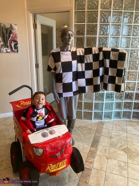 Lightning McQueen and the Checkered Flag Costume Checkered Flag Costume, Lightning Mcqueen Family Costumes, Mcqueen Costume, Lightning Mcqueen Costume, Wheelchair Costumes, Homemade Costume, Costume Works, Vinyl Magnets, 2024 Halloween