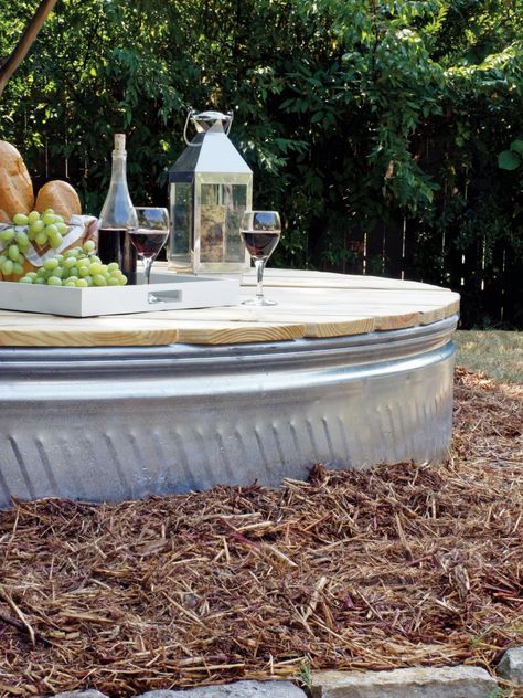 Turn a stock tank and few old tires into this industrial-style fire pit. Stock Tank Fire Pit Ideas, Stock Tank Fire Pit, Trough Fire Pit, Fire Pit Ideas Outdoor, Fire Pit Screen, Galvanized Stock Tank, Cozy Fire Pit, Tank Pools, Feeding Trough