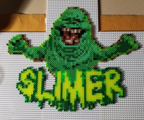 Slimer from Ghostbusters in Perler Beads Please feel free to use the design to make your own Slimer Melty Bead Designs, Easy Perler Beads Ideas, 3d Perler Bead, Perler Art, Digital Embroidery Patterns, Perler Bead Templates, Perler Crafts, Beads Designs, Halloween Beads