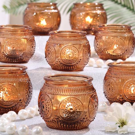 PRICES MAY VARY. Votive Candle Holders Bulk: Enhance your party ambiance with these elegantly crafted round votive candle holders, showcasing intricate sunflower relief patterns. Their mesmerizing design will undoubtedly add perfect finishing touch to your party table decorations. Candle Holders for Table Centerpiece: You will get 12 pack votive candle holders, measuring 2"(Cal) and 2"(H) and the waist Dia is approx 2.55". Let Tea Candle/ Small Votive or LED Tealights in these glass candle holde Boho Western Wedding Tables, Afro Boho Table Setting, Safari Candle Centerpieces, Boho Fall Dinner Table, Terracotta Wedding Guest Tables, Oil Lamps Centerpiece Wedding, Wedding Center Pieces Candle Holders, Boho Hanging Candles, Autumn Wedding Top Table