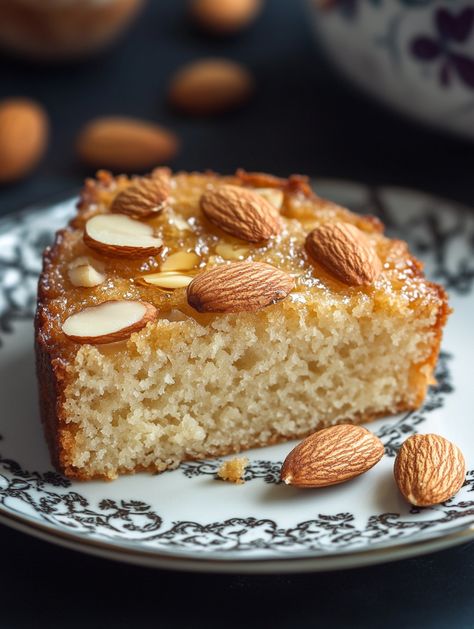 Ingredients:  2 cups flour 1 tsp baking powder ½ tsp salt ¾ cup sugar ½ cup honey ¾ cup butter 3 eggs ½ cup almond flour  Instructions:   Mix dry ingredients, cream butter, and sugar, beat in eggs and honey, fold in almond flour.  Bake at 350°F (175°C) for 30-35 minutes.  A slice reveals a moist, golden texture with a light honey sweetness. Honey Almond Cake, Honey Cakes, Golden Texture, Cream Butter, Honey Almonds, Almond Cake, 3 Eggs, Almond Cakes, Almond Flour