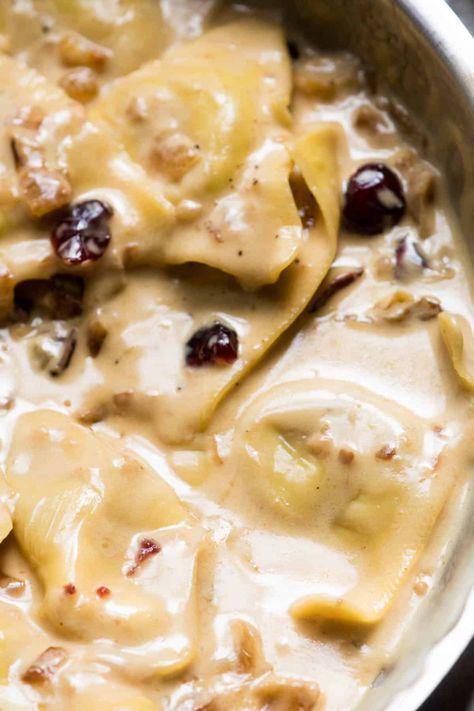 Ultimate fall comfort food! Tender butternut squash ravioli cloaked in rich marsala cream sauce with caramelized onions, dried cranberries and fresh sage. #hungerthirstplay #fallrecipes #comfortfood #pasta #ravioli #butternutsquashravioli #marsala #marsalacreamsauce #fall #autumn #creamypastadishes Marsala Cream Sauce Pasta, Sauce For Butternut Squash Ravioli Cream, Cream Sauce For Butternut Squash Ravioli, Sage Sauce For Ravioli, Butternut Squash Ravioli Cream Sauce, Butternut Squash Ravioli Recipes Sauces, Sauces For Butternut Squash Ravioli, Squash Ravioli Sauce, Butternut Squash Ravioli Sauce