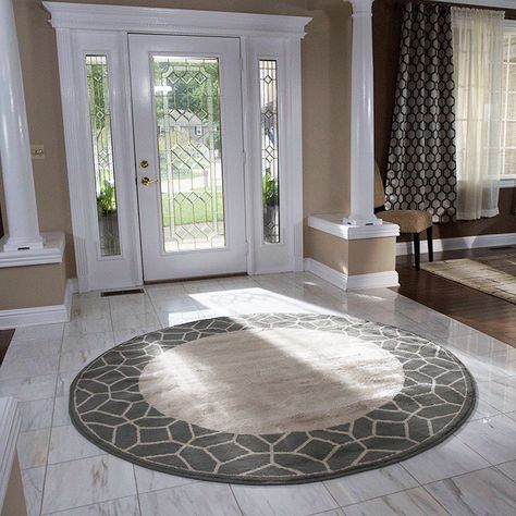 Don’t be afraid to use shapes other than rectangle for your area rug. Round rugs are great for seating vignettes, passageways and entrances. Consider square rugs, runners, oblong or animal-skin shaped rugs for impact. Round Rug Entryway, Round Entry Rug, Lowes Rugs, Round Foyer, Foyer Rugs, Small Entryway Table, Area Rug Dining Room, Apartment Entrance, Square Bath