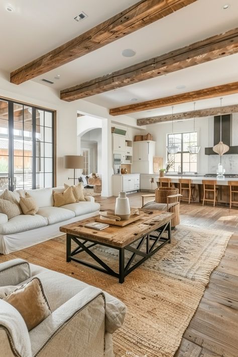 Spacious, modern farmhouse living room with exposed wooden beams, neutral tones, and a mix of rustic and contemporary furniture. Modern Ranch House Decor, Rustic Scandinavian Living Room, Modern Rustic Decor Living Room, Modern Western Home Decor, Farmhouse Chic Living Room, Rustic Chic Living Room, House Moodboard, Rustic Meets Modern, Stylish Farmhouse