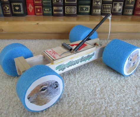 Recently in Physical Science, we were assigned to construct a mousetrap-powered car.  After a great deal of research, I had a basic idea of what I wanted to make.  The end result is what you see.  This mouse trap car is more for speed than for distance, although it's performance seems to be between the two.  It goes a decent distance, and it travels at a decent speed.  While being lightweight, This car is also quite sturdy.  It's fairly easy to make, so give it a... Mouse Trap Car, Mousetrap Car, Nerf Mods, Physics Projects, Nerf Mod, Catnip Mouse, Mouse Trap, Car Racer, Mouse Traps