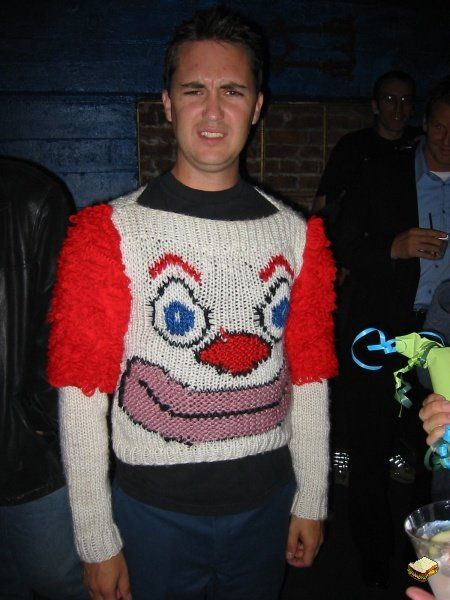 the infamous clown sweater -- This is Wil Wheaton wearing a horrible (and awesome) clown sweater. He’s always good-for-a-laugh, eh? Thank you to my friend Jen Brown for sharing this with me (inspired by this post which features the winning sweater from Bill Cosby’s recent sweater tournament). Ugly Clowns, Poorly Dressed, Ugly Sweater Contest, Wil Wheaton, Christmas Sweater Party, A Clown, Ugly Christmas Sweater Party, Ugly Sweater Party, Clipuri Video