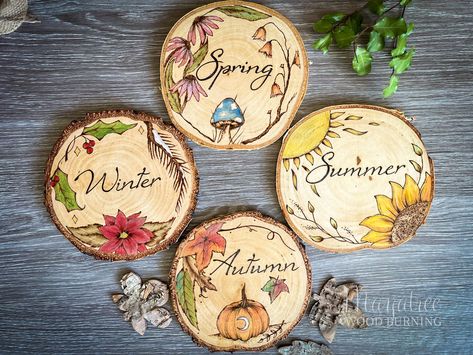 A set of four handmade signs - one for each beautiful season. 'Four Seasons' original artwork hand burned (pyrography) and painted onto solid wood slices. These were made for you to show off each one as a part of your seasonal decor or hang them as a group for a beautiful year round display. Each wood slice is illustrated with things in nature that I most associate with those seasons.  The designs are hand burned into wood then painted with the most gorgeous slightly shimmery watercolours in sea Four Seasons Artwork, Pagan Decorations, Wood Slice Decor, Personalized Family Ornaments, Wood Slice Crafts, Wood Slice Art, Home Decor Wood, Wood Burning Crafts, Wood Painting Art