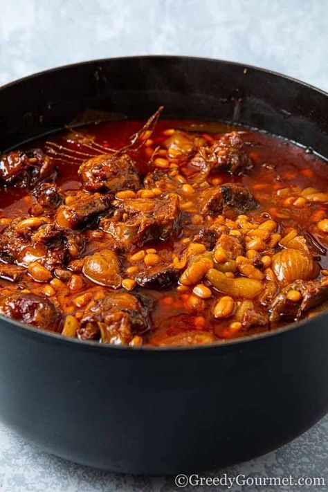 Oxtail stew is the perfect comfort food, especially during winter. This is made even better when braised with beans and red wine. When oxtails are cooked for at least 3 hours, incredible and divine flavors are released. Indulge in this delightful and incredibly luxurious recipe with your family. #oxtailstewwithbeansandredwine #oxtailstewbraised #oxtailstew #oxtailwithbeans #oxtailwithredwine #oxtail #oxtailrecipe #homecookedrecipes #winterrecipe Recipes For Oxtails, Stew With Beans, Jamaican Oxtail Stew, Cooking Oxtails, Oxtail Stew Recipe, Beef Oxtail, Meat Entrees, Oxtail Stew, Oxtail Recipes