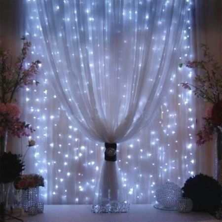 The Winter Wonderland Party theme works well for New Year's Eve but could be used for any occasion that requires a little sparkle. Led Curtain Lights, Curtain String Lights, Outdoor Blinds, Icicle Lights, Curtain Lights, Fairy String Lights, String Lights Outdoor, Wedding Lights, Christmas Wedding