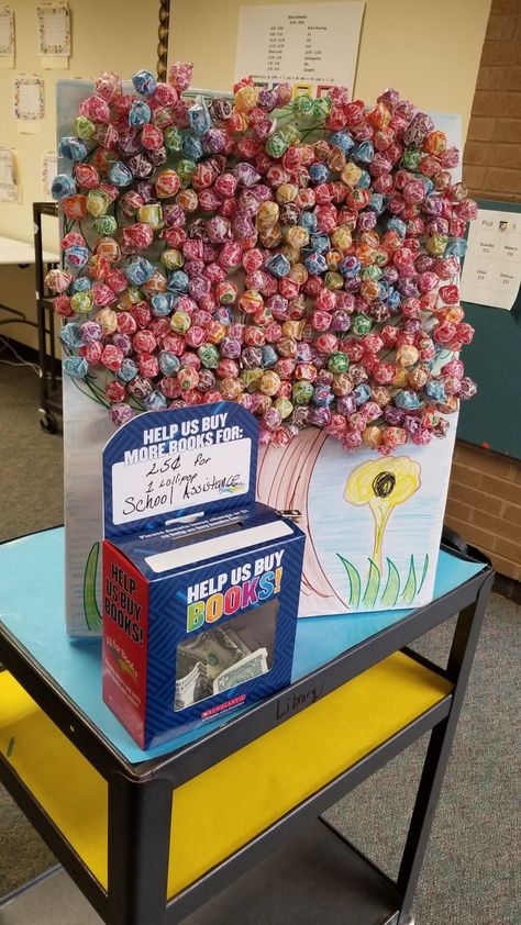 Book Fair Ideas Display, Library Fundraiser, School Donations, School Book Fair, School Library Decor, Lollipop Tree, School Library Displays, Fair Theme, Scholastic Book Fair