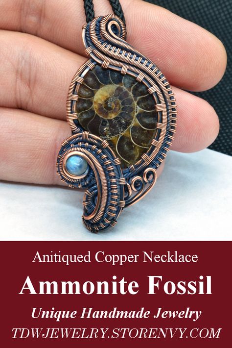 Inspired by steampunk fashion, this ammonite fossil pendant was wire wrapped with pure antiqued copper wire. Copper wire wraps give the appears of gears and cogs inspired by 19th-century industrial steam-powered machinery. #steampunk #cyberpunk #steampunkfashion #ammonite #sciencefiction #industrial #steam #victorian #science #fantasy #steam #fossil #jewelry #pendant #necklace #gears #cog #prehistoric #ancient #sea #spiral #sacredgeometry #Fibonacci #metaphysical #celtic #wiccan #witch #unique Ammonite Wire Wrap, Gears And Cogs, Ammonite Jewelry, Copper Wire Crafts, Semi Precious Necklace, Wire Wrap Jewelry Designs, Wiccan Witch, Steam Punk Jewelry, Fossil Jewelry