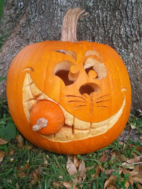 Pumpkin Eating Baby Pumpkin Carving, Baby Pumpkin Carving, Cheshire Cat Pumpkin, Mischievous Character, Cat Pumpkin Carving, Baby Pumpkin, The Cheshire Cat, Cat Eating, Pumpkin Carvings