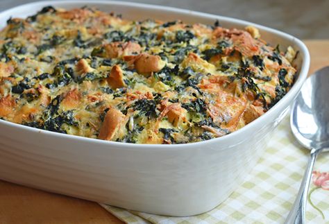 This elegant brunch strata — really a savory bread pudding with spinach, cheese and cubes of bread baked in custard — is perfect for entertaining. You do all of the preparation the night before and let it rest in the fridge overnight. The next morning you simply turn the oven on, place the strata in, and effortlessly wait for your brunch to emerge. It’s a ‘wow’ dish so you can keep … Easter Brunch Drinks, Spinach Casserole Recipes, Cheese Strata, Make Ahead Brunch Recipes, Strata Recipes, Make Ahead Brunch, Savory Bread Puddings, Spinach Casserole, Spinach Cheese