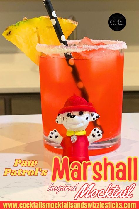 This image shows a red drink with a white rim with a yellow pineapple garnish and a black and white pokadot straw with marshall from that paw patrol figure in front. Paw Patrol Themed Birthday Party, Marshall Paw Patrol Birthday, Mocktail Party, Disney Inspired Cocktails, Movie Night Dinner, Movie Night Theme, Movie Night For Kids, Paw Patrol Movie, Disney Dinner