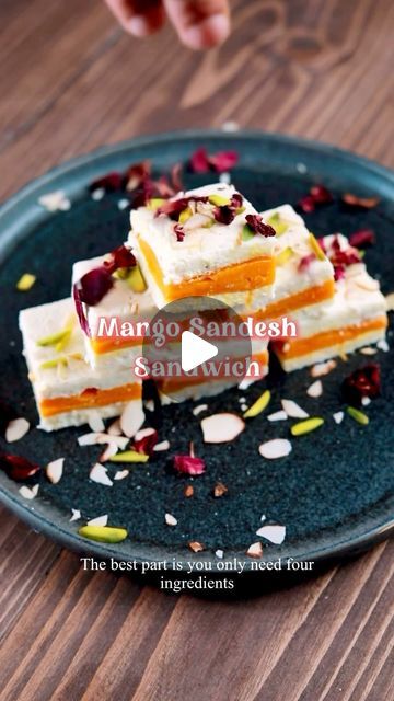 Aruna Vijay on Instagram: "Mango sandesh sandwich   I know Rasamali was ranked as the second best cheese dessert in the world, but I still love a good Sandesh any day. Also what’s not to like about a Sandesh, it’s healthy, simple & quick to make.  This is my last mango recipe of this season and by far know of the best you will ever make!!  Recipe - Homemade paneer - 200 gms  Powdered sugar - 4 tbsp  Cardamom powder - 1/2 tsp Sliced Alphonso mangoes - 2   1. Start by making some fresh homemade chenna, mash this with heel of your palm. 2. Then add in powdered sugar, cardamom powder and bring it together  3. Divide this into 2 equal portions and flatten it out on a cling wrap.  4. Place mangoes one side  and carefully cover it with another one to create a sandwich.  5. Wrap this completely an Sandesh Recipe, Mango Rasmalai Cake, Frozen Mango Recipes Baking, Frozen Mango Recipes Desserts, Fresh Mango Dessert Recipes, Mango Sandesh Cake, Veg Snacks, Deserts Easy, Indian Dessert Recipes