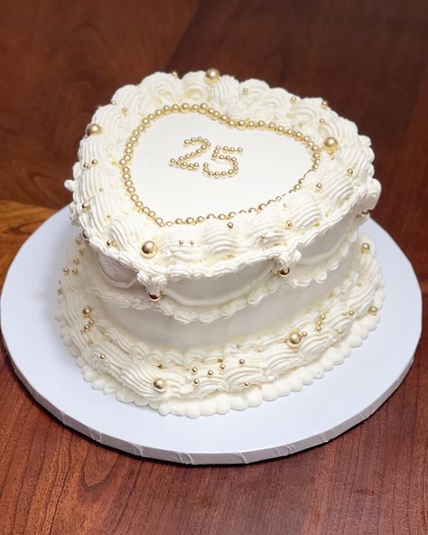 White and Gold Vintage Heart Cake🤍✨ #vintagecakes #vintagestyle #vintage #vintageheartcake #cakes #igcakes #cakeoftheday #birthdaycake #birthday #25 #25thbirthday #25thbirthdaycake #heartcake #whiteandgold #goldsprinkles #cakeinspiration #cakeinstagram #houstontx #cypresstx #wallertx White And Gold Vintage Cake, White And Gold Heart Cake, Gold Heart Cake, White Heart Cake, 21st Bday Cake, Birthday 25, Vintage Heart Cake, Cake With Gold, Dream Birthday