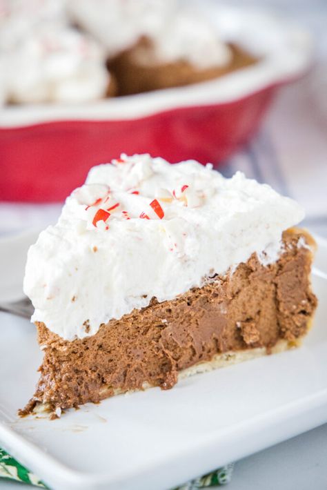 Peppermint French Silk Pie - a rich, decadent and chocolate French Silk Pie that is flavored with peppermint for a fun twist! It is topped with whipped cream and peppermint candy for the perfect festive dessert. French Silk Pie Easy, Peppermint Whipped Cream, Crushed Peppermint, French Silk Pie, Silk Pie, Peppermint Candies, Farm Wife, Festive Desserts, Chocolate Pie