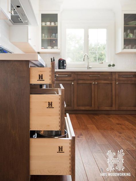 The doors and drawer fronts are shaker style. The cabinetry is maple with the base cabinets having a dark walnut stain, which contrast very nicely with the pure white upper cabinets and backsplash. The counter top is a white caesarstone.   #custom #kitchen #cabinetry #white #woodworking #toronto #crownmoulding #shaker #maple #stain #interiordesign   All photos provided by Ryan Fung Photography - http://ryanfungphotography.com/ Ideas For Kitchen Cabinets, Shaker Style Kitchen Cabinets, Kitchen Credenza, Dark Counters, Kitchen Cabinet Trends, Cabinet Faces, Maple Stain, Ideas For Kitchen, Shaker Style Kitchens