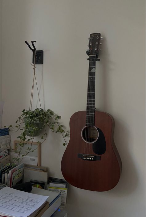 Guitar On Wall Aesthetic, Room Guitar Aesthetic, Guitar In Bedroom Aesthetic, Guitar Stand Aesthetic, Guitar In Room Aesthetic, Bedroom With Instruments, Hanging Guitars On Wall Ideas Bedroom, Guitar Pictures Aesthetic, Guitar Corner Bedroom