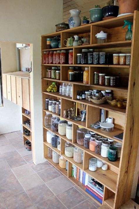 Our custom built homestead pantry was designed to fit gallon, half gallon, and quart sized mason jars to maximize space and efficiency! We were able to store so much food in our 350 square foot tiny house! Learn more at Homestead Honey.  #pantry #foodstorage #tinyhouse #DIY Pantry Homestead, Canning Storage, Ultimate Pantry, Free Standing Pantry, Canned Good Storage, Homestead Pantry, Standing Pantry, Homestead Kitchen, Homestead Life