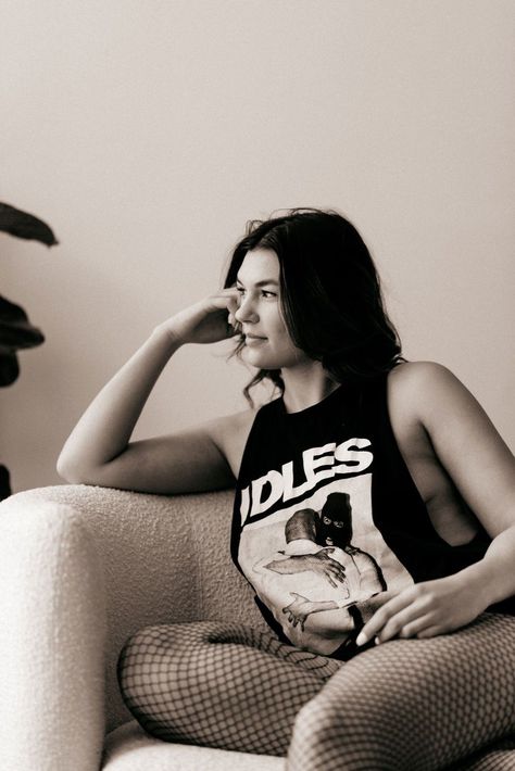 A young woman in a sleeveless band tee and fishnet tights, sitting casually in a chair. Stratford Ontario, Cambridge Ontario, Park Hill, Fishnet Tights, A Chair, Young Woman, Band Tees, Cambridge, Ontario