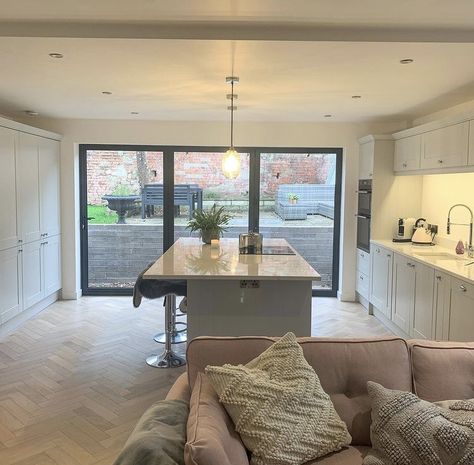 The homeowner opted for the 3 wide pane bifolds for their newly renovated kitchen and we think they made the best decision, creating an open, light and airy space at the hub of the house. It seems the perfect place to enjoy your morning cuppa ☕️ We love the traditional shaker style kitchen vibe but they all need a modern edge with bifolds or sliding doors to compliment the room and create the indoor/outdoor space that all homeowners aim to have, just like this one!⠀ Stone Kitchen Design, Backsplash With Dark Cabinets, Kitchen Diner Extension, Cosy Living, Diy Countertops, Galley Kitchen, Kitchen Extension, Bespoke Kitchens, Kitchen Diner