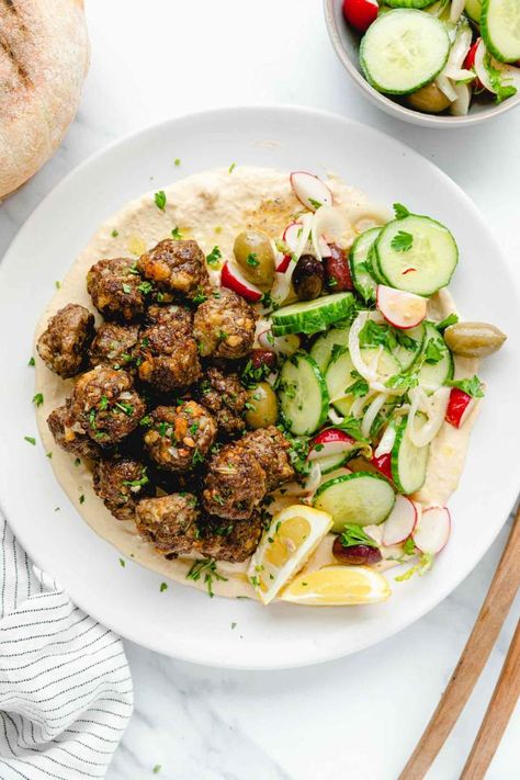 Easy Mini Oven Baked Meatballs on a plate with salad, hummus, and lemon Bread Meatballs, Hummus And Pita Bread, Basic Hummus Recipe, Meatballs Healthy, Oven Baked Meatballs, Baked Meatballs, Hummus And Pita, Meatball Recipes Easy, Meatball Bake