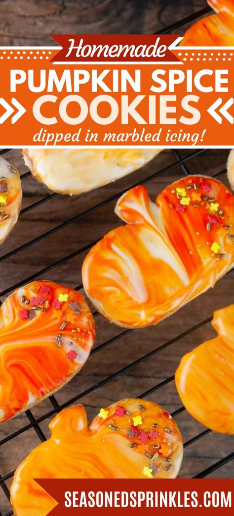 These pumpkin cut out cookies are a hit all fall long with the warming spices. Decorating them is a snap thanks to dipping the baked cookie into the sugar cookie icing for a beautiful marbled finish. #pumpkin #cookie #pumpkinspice #sugarcookie #cookiedecorating #recipe #thanksgiving #fall #halloween Spiced Pumpkin Cookies, Pumpkin Cookie Cutouts, Marble Icing Cookies, Fall Cookie Decorating Ideas, Thanksgiving Cutout Cookies, Thanksgiving Cookies Decorated Easy, Pumpkin Decorated Cookies, Fall Themed Cookies, Flavored Sugar Cookies