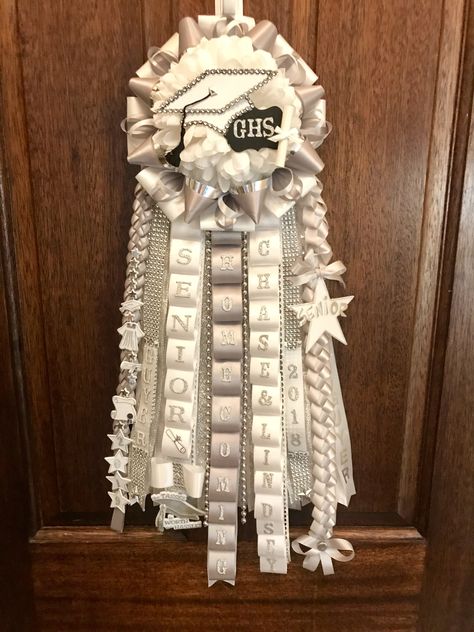 White Garter Homecoming, Baseball Hoco Garter, Homecoming Mum For Seniors, Hoco Garter Ideas Senior, Garter Homecoming Ideas, Homecoming Cheer Garters, Senior Mum Ideas Homecoming, Garter Homecoming For Guys Band, Homecoming Mum Head Ideas