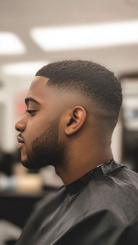 Discover the hottest Black men’s hairstyles for 2025, featuring fresh cuts and bold looks. From taper fades to curls and waves, these styles are sure to elevate your grooming game. #BlackMensHair #MensHaircuts2025 #FreshCuts #TaperFade #CurlyHairGoals #WaveGame #BuzzCutStyles #FadeHaircut #HairTransformation #MensGrooming #BlackHairInspiration #NaturalHairStyles #AfroCurls #HairTrends2025 #BlackHairCare Box Cut Hair, High Fade Black Men, Fade Styles For Men, Tapered Haircut Black, Man Haircut Fade, Clipper Haircut, Fresh Haircuts, Fade Haircut Short, Side Cut Hairstyles