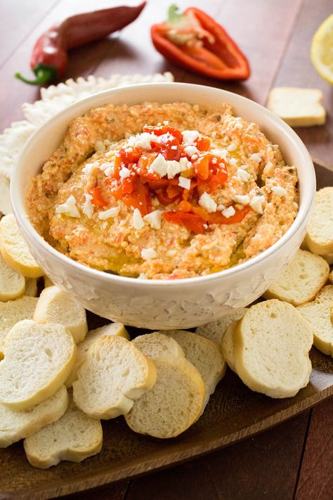 A classic Greek dip recipe, Htipiti, made with feta cheese, roasted red peppers, olive oil, garlic, lemon juice and seasonings. Be careful, it is quite addictive. Make this for your next party or tailgating session and watch it disappear. Feta Cheese Dip Recipes, Hot Dip Recipes, Recipes With Cheese, Red Pepper Dip Recipe, Pepper Dip Recipe, Greek Dip Recipes, Feta Cheese Dip, Dip Recipes Hot, Salad Appetizer Cups