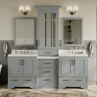 The Stafford bathroom vanity makes bathroom storage look glamorous with this statement piece. Sturdy with a hardwood frame, this vanity is sure to last and stand the test of time. Ample storage space, including a cabinet and dovetail drawers, ensures functionality, this stunning vanity is the perfect upgrade for your bathroom. Base Finish: Gray | Ariel Bath Stafford 84.25" Double Bathroom Vanity w / Quartz Top w / Mirror 89.0 H x 84.25 W x 22.0 D in Wood / Quartz Top in Gray | 89" H X 84.25" W X