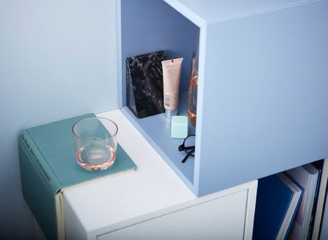 A DIY bedside table setup made of cubic cabinets that hold some cosmetic tubes, a pair of spectacles and a glass. Floating Nightstand Ikea, Nightstand Hack, Diy Bedside Table, Diy Bedside, Ikea Nightstand, Traditional Bedside Tables, Pretty Pegs, Ikea Eket, Small Bedside