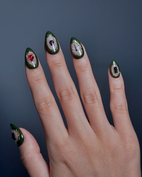 Embrace the spooky season with this Halloween-inspired nail set! Featuring delicate beetle, ladybug, and spider designs framed in antique-style gold accents on an olive green background, these nails are perfect for a touch of creepy elegance. A unique and playful way to celebrate Halloween, capturing the essence of autumn with a dark, mysterious twist. #nomoodnails #halloweennails #pressons #pressonnails Olive Green Background, Dark Mysterious, Green Background, Green Backgrounds, Halloween Nails, Antique Style, Spooky Season, Gold Accents, Frame Design