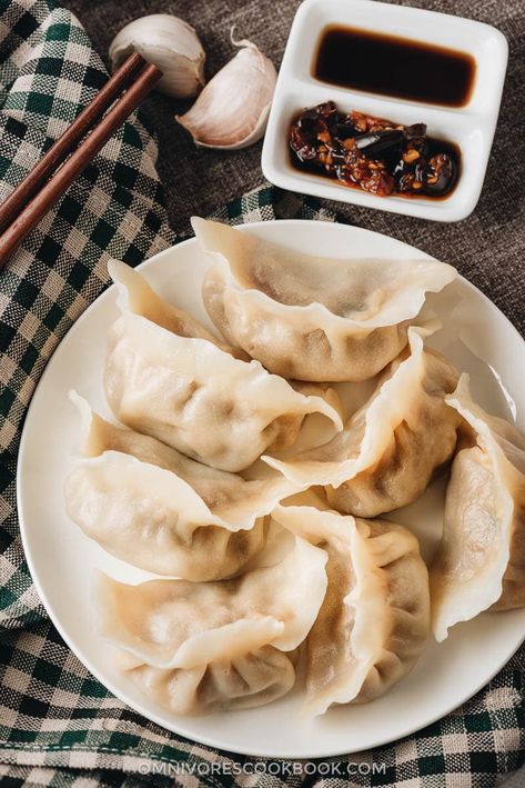 Mom’s Best Lamb Dumplings | These soupy lamb dumplings are irresistible! The lamb meat is seasoned with soy sauce, Sichuan peppercorn, and ginger to create a savory umami. The minced carrot adds a hint of sweetness. The zucchini adds some moisture to the filing, so that the hearty, flavorful broth fills up the whole dumpling! Pork And Chive Dumplings, Garlic Ginger Chicken, Best Dumplings, Frozen Dumplings, Dumpling Filling, Pork Dumpling, Homemade Dumplings, Steamed Dumplings, Chinese Dumplings