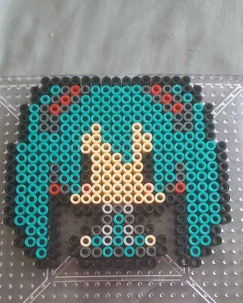 Hatsune Miku   Pattern belongs to T0XIC_FANTA5Y from  KandiPatterns  #hatsunemiku #vocaloid #mikuhatsune #anime #manga #perler #perlerbead #annie #deviantart #art #kandipatterns #toxicfantasy Miku Perler Bead Patterns, Soul Eater Perler Beads, Hatsune Miku Perler Beads, Miku Perler Beads, Perler Bead Anime, Anime Perler Beads, Anime Perler Bead Patterns, Anime Perler, Melt Beads Patterns