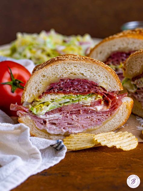 Piled high with meats, cheese, and a tangy, irresistible grinder salad, this Italian Grinder Sandwich Recipe is perfect for feeding a crowd. Italian Grinders, Grinder Sandwich Recipe, Italian Grinder Sandwich, Italian Sandwich Recipes, Italian Grinder, Grinder Salad, Grinder Sandwich, Boiled Ham, Braised Chicken Breast