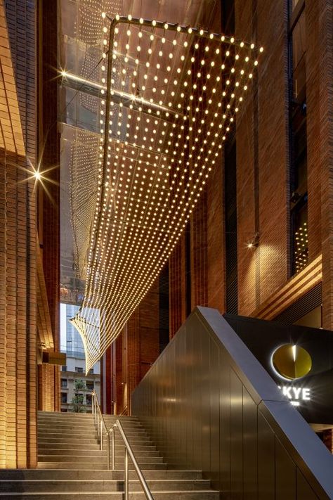 "Reflect" Light Sculpture at Arc by Crown | Tensile Design & Construct Atrium Lighting Design, Atrium Lighting, High Ceiling Lighting, Corridor Lighting, Colored Led Lights, Facade Lighting, Entryway Lighting, Dappled Light, Ceiling Installation