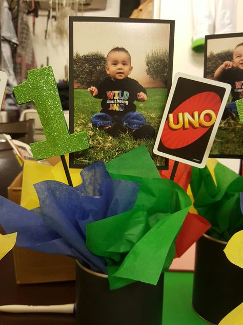 Uno centerpieces Uno Party Centerpieces, Uno Centerpiece First Birthdays, Uno Theme Centerpieces, First Birthday Centerpieces Boy, Uno Party, First Birthday Centerpieces, Uno Birthday, High Chair Decorations, Baby First Birthday Themes