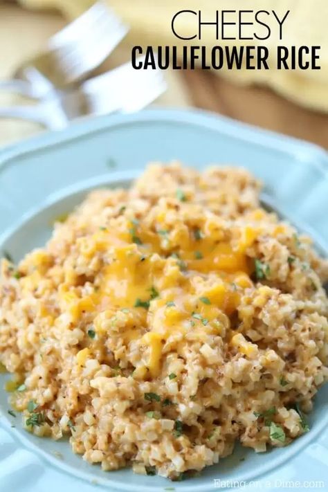 Looking for an easy keto side dish? You're going to love Easy Cheesy Cauliflower Rice. With just a few ingredients you can have Keto Cheesy Cauliflower. Cheesy Riced Cauliflower, Cauliflower Rice Cheese, Cheesy Cauliflower Recipes, Easy Cheesy Cauliflower, Cheesy Cauliflower Rice, Keto Side Dish, Cauliflower Rice Recipe, Keto Vegetables, Crockpot Side Dishes